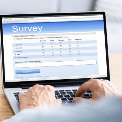 Online Customer Survey Form. Filling Feedback On Laptop Screen